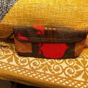 The Clutch Leonor Mendoza paper purse in brown and burnt orange exudes style